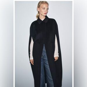 Zara Oversized cape with a lapel collar made of a wool blend knit.